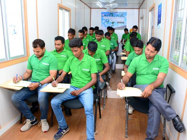 Students at a container classroom in Haryana's Ambala district. Mobile schools, classrooms held in a container, are teaching graduates to bridge their skills gap in rural and impoverished areas. Students at a container classroom in Haryana's Ambala district. Mobile schools, classrooms held in a container, are teaching graduates to bridge their skills gap in rural and impoverished areas.