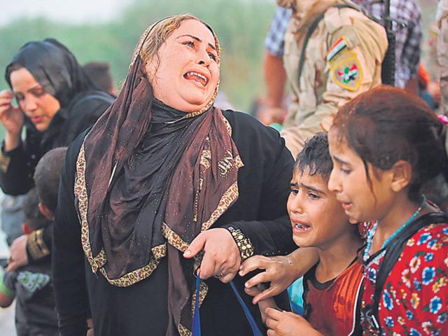 Women who fled the Isis-engineered violence in Ramadi, Iraq, on May 19 (Reuters)