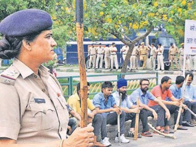 Members of the Tricity Taxi Operators Welfare Association protesting against the police (Sant Arora/HT Photo) Members of the Tricity Taxi Operators Welfare Association protesting against the police (Sant Arora/HT Photo)