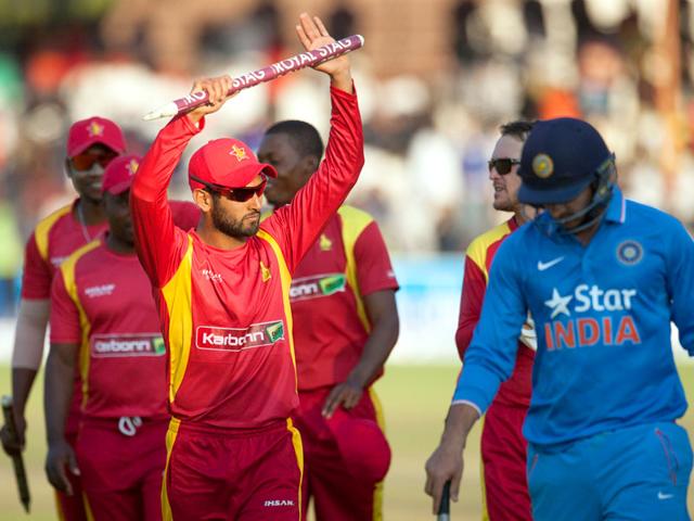 Stand-in Zimbabwe captain Sikandar Raza, left, acknowledges the crowd after securing victory over India. (AFP Photo)