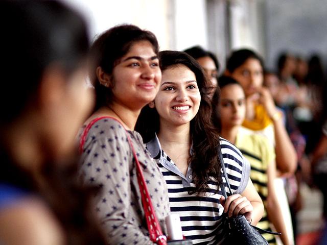 Students enjoying on the first day of college at Aryabhatta college of Delhi University in north campus in New Delhi. (HT Photo/Arun Sharma)