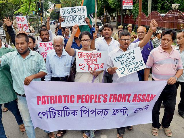 Activists in Guwahati walk with the banner of Patriotic People’s Front of Assam, protesting against Ulfa militants who have targeted civilians in the state. (PTI Photo) Activists in Guwahati walk with the banner of Patriotic People’s Front of Assam, protesting against Ulfa militants who have targeted civilians in the state. (PTI Photo)