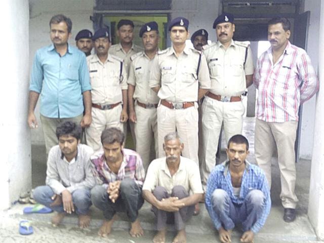 Shivdayal and Chandrabhan with two of his friends in police custody a day after police recovered the body of Chandrabhan’s son who was sacrificed for treasure in Raisen district. (HT photo) Shivdayal and Chandrabhan with two of his friends in police custody a day after police recovered the body of Chandrabhan’s son who was sacrificed for treasure in Raisen district. (HT photo)