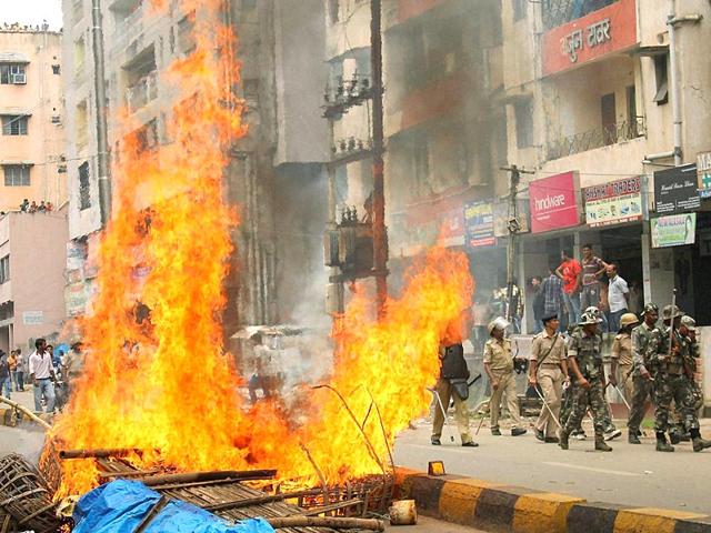 Security personnel patrol along a road during a bandh after a clash between two communities in Jamshedpur's Mango area . (PTI Photo) Security personnel patrol along a road during a bandh after a clash between two communities in Jamshedpur's Mango area . (PTI Photo)