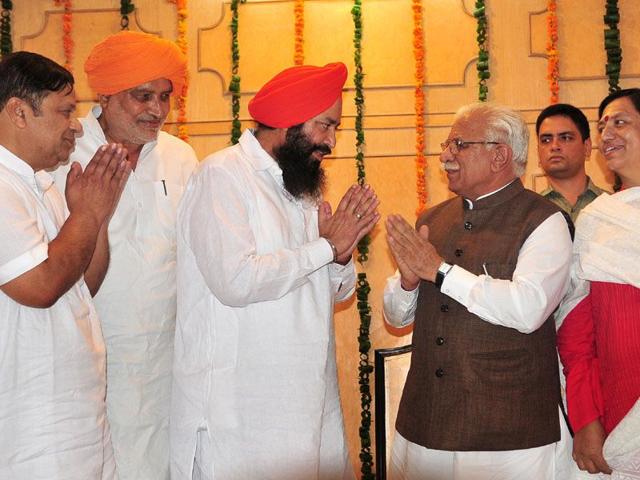 Haryana chief minister, Manohar Lal Khattar greeting the four newly sworn in Chief Parliamentary Secrataries at Haryana Niwas, Chandigarh on Thursday.