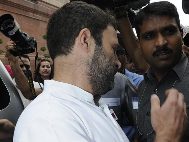 Congress vice president Rahul Gandhi steps back after he had a mike thrust into his eye as media persons rushed at him for quotes after Lok Sabha was adjourned on the 3rd day of the Monsoon session of Parliament in New Delhi on Thursday.(Sonu Mehta/HT Photo)