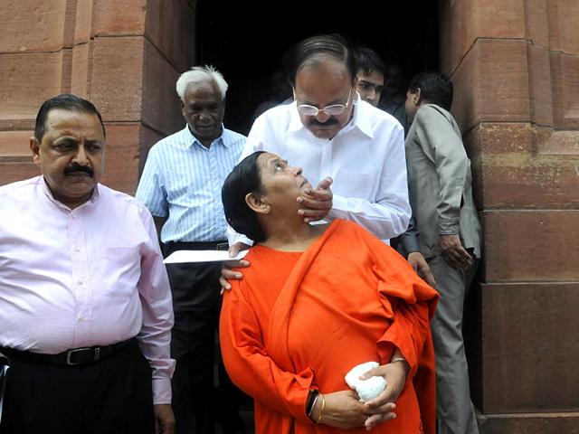 BJP leaders Venkaiah Naidu and Uma Bharti coming out after attending the monsoon session (Sushil Kumar/HT Photo)