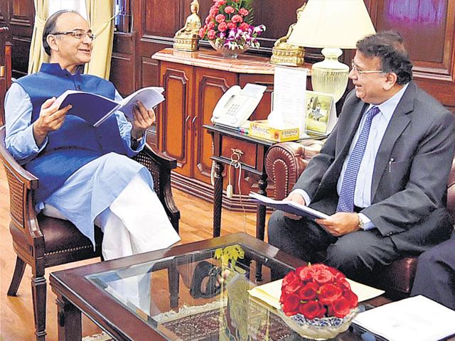 Finance minister Arun Jaitley (left) with Justice AP Shah, chairman of the committee on minimum alternate tax (MAT), after the latter submitted his report, at the North Block on Friday. (PTI Photo) Finance minister Arun Jaitley (left) with Justice AP Shah, chairman of the committee on minimum alternate tax (MAT), after the latter submitted his report, at the North Block on Friday. (PTI Photo)
