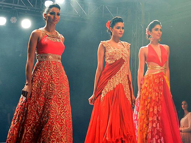 Experiment with flares. Unicoloured, flared gowns with sequins look elegant yet sensuous. (AFP Photo/ Manjunath Kiran) Experiment with flares. Unicoloured, flared gowns with sequins look elegant yet sensuous. (AFP Photo/ Manjunath Kiran)