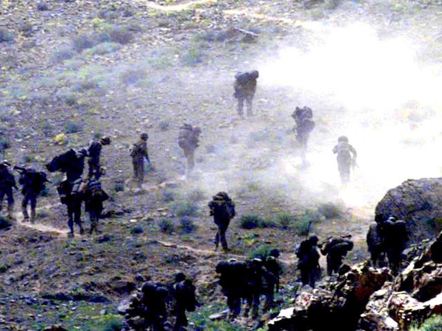 Braving the enemy's shells and hostile terrain ,Indian troops moving forward in Mushkoh Valley. HT photo Manish Swarup