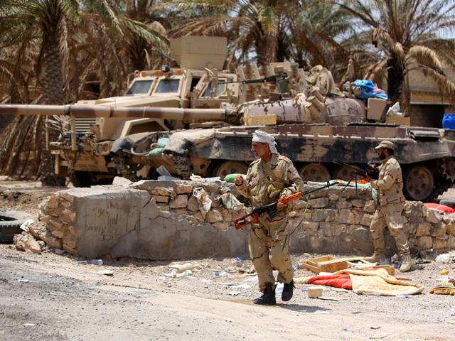 Iraqi Army soldiers with new US-made weapons take combat positions at the front line in an eastern suburb of Ramadi, backed by Shiite and Sunni pro-government fighters (AP Photo) Iraqi Army soldiers with new US-made weapons take combat positions at the front line in an eastern suburb of Ramadi, backed by Shiite and Sunni pro-government fighters (AP Photo)