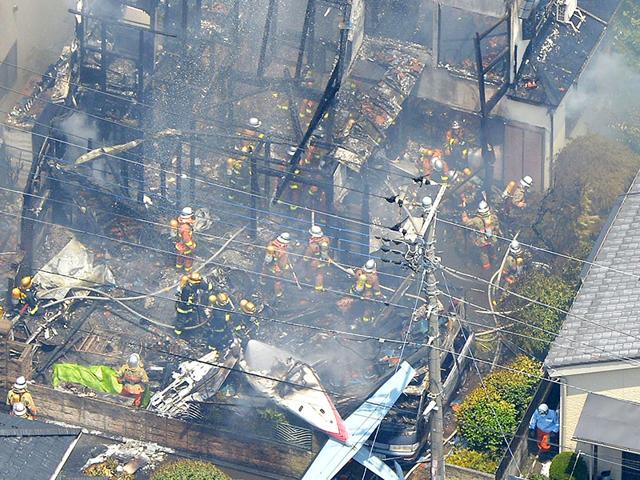 An aerial view shows debris of a crashed light plane (bottom C) and burning houses are seen after the plane went down in a residential area and burst into flames, in Chofu, outskirt of Tokyo. (Reuters) An aerial view shows debris of a crashed light plane (bottom C) and burning houses are seen after the plane went down in a residential area and burst into flames, in Chofu, outskirt of Tokyo. (Reuters)