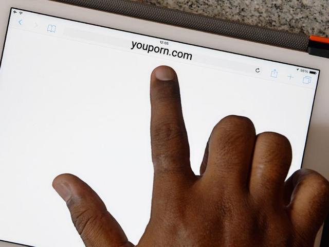 An internet user points out at a porn site showing a blank screen after being blocked by the internet service providers based on directive issued by the telecom ministry to block porn websites across the country. (AFP Photo/Manjunath Kiran)