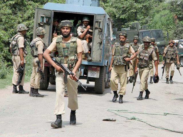 Security forces during a terrorist attack on a convoy of Border Security Force (BSF) on the Jammu-Srinagar National Highway in Udhampur district of Jammu and Kashmir on Wednesday. (PTI Photo)
