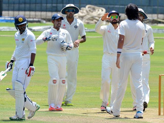 Indian cricket Test captain Virat Kohli, third from right, and teammates celebrate the dismissal of Upul Tharanga, left, during play on the second day of the warm-up game before the first Test. (AFP Photo) Indian cricket Test captain Virat Kohli, third from right, and teammates celebrate the dismissal of Upul Tharanga, left, during play on the second day of the warm-up game before the first Test. (AFP Photo)