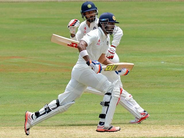 India's Lokesh Rahul, right, and Shikhar Dhawan run between the wickets on the first day . (AFP Photo) India's Lokesh Rahul, right, and Shikhar Dhawan run between the wickets on the first day . (AFP Photo)