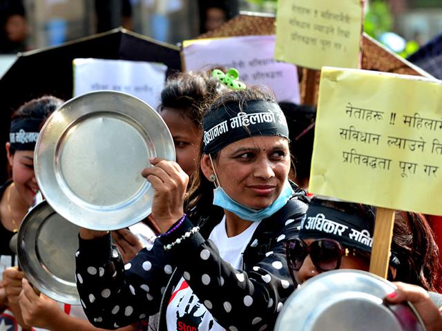 Nepalese activists bang plates and spoons as they take part in a protest demanding equal citizenship rights in the new constitution in Kathmandu on August 10, 2015. Nepal's parliament is proposing to bar all single parents from passing on their citizenship to their children in a new national constitution, sparking outrage among rights activists. (AFP PHOTO) Nepalese activists bang plates and spoons as they take part in a protest demanding equal citizenship rights in the new constitution in Kathmandu on August 10, 2015. Nepal's parliament is proposing to bar all single parents from passing on their citizenship to their children in a new national constitution, sparking outrage among rights activists. (AFP PHOTO)