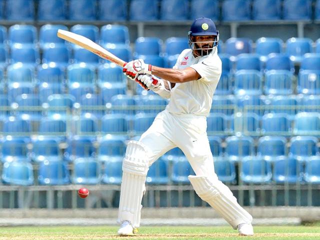 Dhawan plays a shot on the first day. (AFP Photo) Dhawan plays a shot on the first day. (AFP Photo)