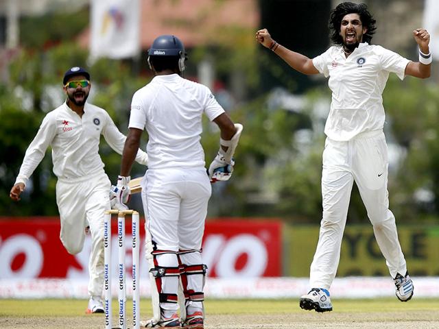 Ishant Sharma, right, celebrates the wicket of Dimuth Karunaratne. (Reuters Photo)