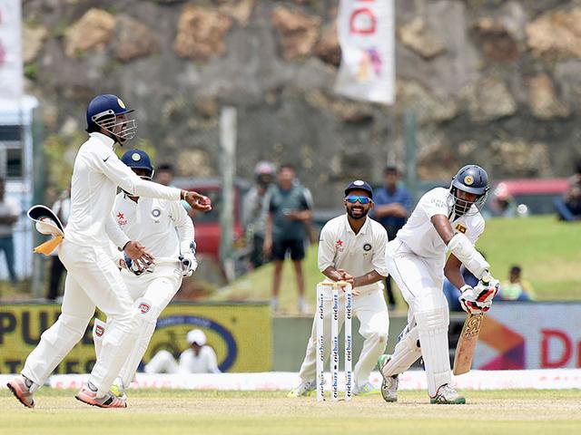 Kohli, right, and fielders Lokesh Rahul, left, and Rahane, centre, celebrate the dismissal of Sri Lankan batsman Jehan Mubarak. (AFP Photo)