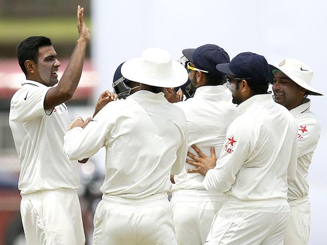 Off-spinner Ravichandran Ashwin, left, celebrates after taking the wicket of Sri Lanka's Kumar Sangakkara on Day 1 of the first Test match in Galle, on August 12, 2015. (Reuters Photo)