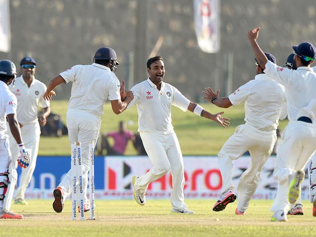 Indian cricketer Amit Mishra (C) and teammates celebrate after dismissing Sri Lankan batsman Kaushal Silva (L) during the second day of the opening Test match between Sri Lanka and India at The Galle International Cricket Stadium in Galle. AFP PHOTO/ Ishara S. KODIKARA