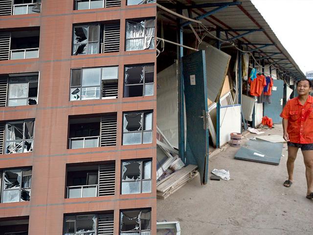 Alongside pristine new buildings that epitomise China's rise sat twisted metal, torn off roofs and burnt out huts (Photo: AFP/AP) Alongside pristine new buildings that epitomise China's rise sat twisted metal, torn off roofs and burnt out huts (Photo: AFP/AP)