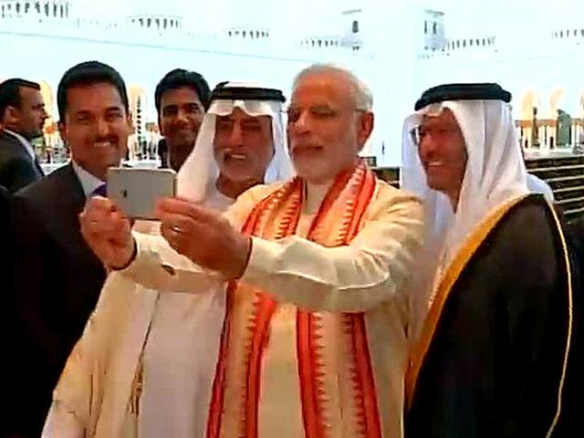 Indian Prime Minister Narendra Modi, middle, takes a selfie next to Sheikh Hamdan bin Mubarak Al Nahyan, UAE Minister of Higher Education and Scientific Research, left, as they tour the Sheikh Zayed Grand Mosque during the first day of his two-day visit to the UAE, in Abu Dhabi, United Arab Emirates, Sunday, Aug. 16, 2015. (AP Photo) Indian Prime Minister Narendra Modi, middle, takes a selfie next to Sheikh Hamdan bin Mubarak Al Nahyan, UAE Minister of Higher Education and Scientific Research, left, as they tour the Sheikh Zayed Grand Mosque during the first day of his two-day visit to the UAE, in Abu Dhabi, United Arab Emirates, Sunday, Aug. 16, 2015. (AP Photo)
