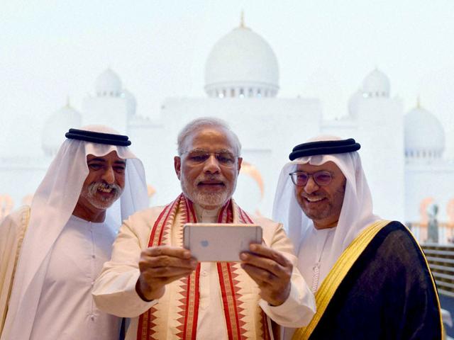 Prime Minister Narendra Modi takes a selfie with Sheikh Hamdan bin Mubarak Al Nahyan, UAE Minister of Higher Education and Scientific Research, during his visit to the Sheikh Zayed Grand Mosque, in Abu Dhabi, UAE. (PTI Photo)