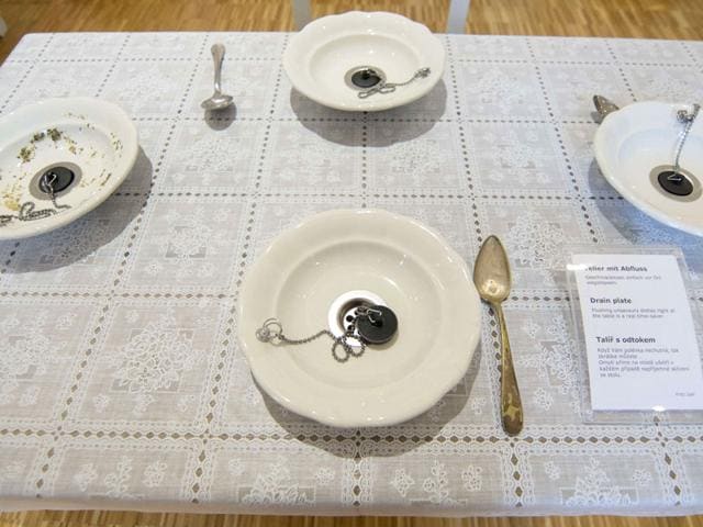 Plates with drains are displayed at 'Nonseum' museum. Soup, poured into the bowl, can be drained out of the plates. (AFP Photo/ Joe Klamar) Plates with drains are displayed at 'Nonseum' museum. Soup, poured into the bowl, can be drained out of the plates. (AFP Photo/ Joe Klamar)