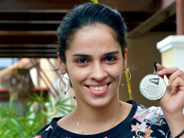 Saina Nehwal poses with her World Badminton Championships silver medal during an interaction with the media at her residence in Hyderabad on August 18, 2015. (PTI Photo) Saina Nehwal poses with her World Badminton Championships silver medal during an interaction with the media at her residence in Hyderabad on August 18, 2015. (PTI Photo)