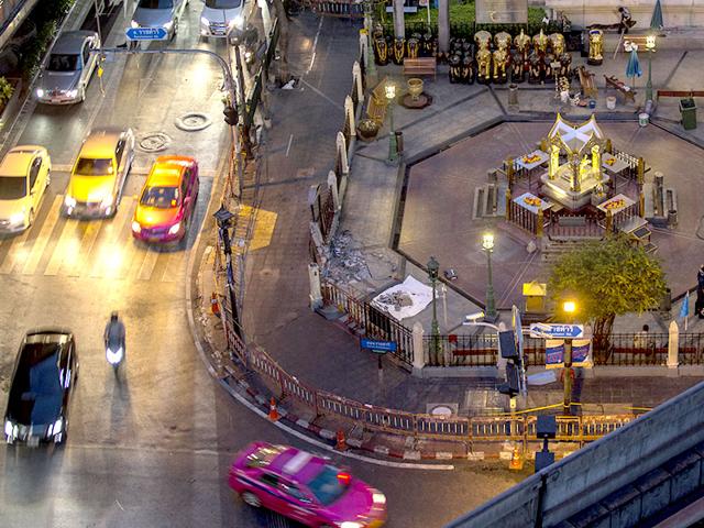 Traffic resumes near the site of Monday's deadly blast in central Bangkok. The shrine's location adds to its popularity, offering an open-air place for prayer amid the capital's gleaming shopping malls and five-star hotels. (Reuters Photo)