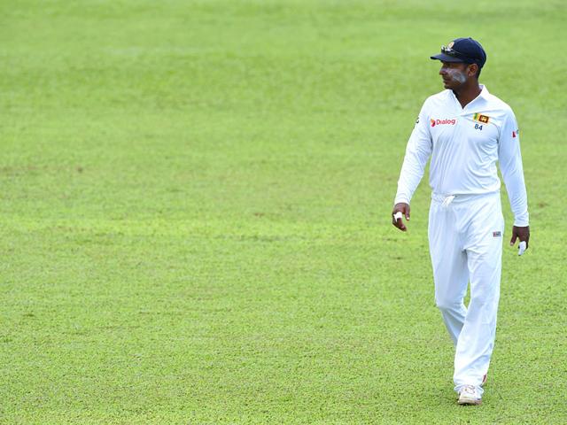 Sangakkara keeps an eye on proceedings while fielding. (AFP Photo)
