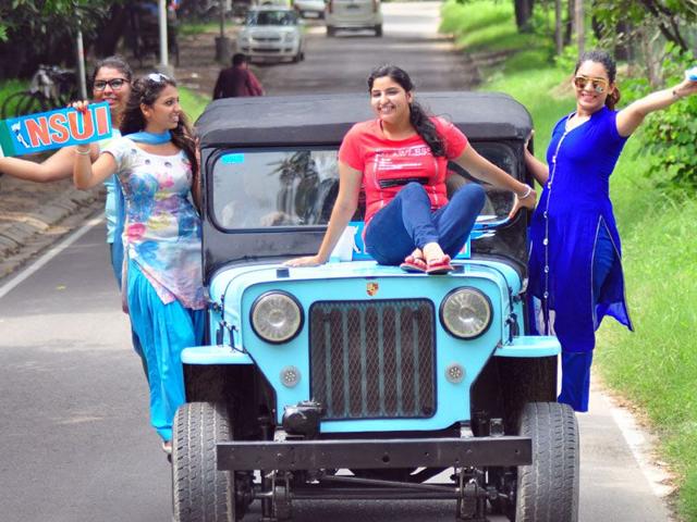 NSUI supporters campaigning in a jeep which has been painted blue to symbolise the party’s colour at Panjab University on Wednesday. (Karun Sharma/HT)