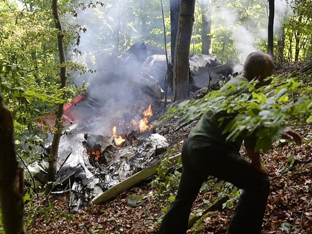 A part of the light aircraft that crashed near the village of Cerveny Kamen, Slovakia. Two planes carrying dozens of parachutists collided in midair over western Slovakia, killing several people, officials said (AP Photo) A part of the light aircraft that crashed near the village of Cerveny Kamen, Slovakia. Two planes carrying dozens of parachutists collided in midair over western Slovakia, killing several people, officials said (AP Photo)