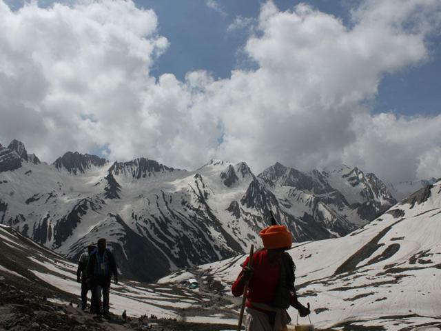 A pilgrim making his way through the tough terrain to reach the Amarnath Shrine. Keshav Singh/HT