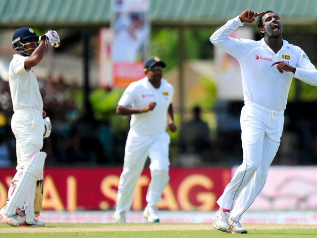 Mathews (R) celebrates with teammates after the dismissal of India's Ravichandran Ashwin. (AFP Photo)