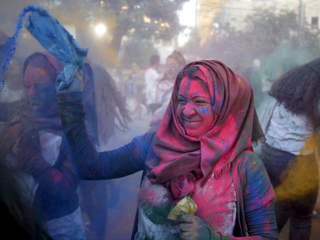 Inspired by the Hindu spring festival of Holi, Palestinians celebrate the Festival of Colours. A reveller takes part in the festival organized by Palestinian activists in the West Bank city of Ramallah on August 20, 2015. (Reuters/ Mohamad Torokman) Inspired by the Hindu spring festival of Holi, Palestinians celebrate the Festival of Colours. A reveller takes part in the festival organized by Palestinian activists in the West Bank city of Ramallah on August 20, 2015. (Reuters/ Mohamad Torokman)