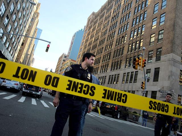 Police cordon off the scene in lower Manhattan where two people were shot at the Federal Immigration Court in New York City. (AFP Photo) Police cordon off the scene in lower Manhattan where two people were shot at the Federal Immigration Court in New York City. (AFP Photo)