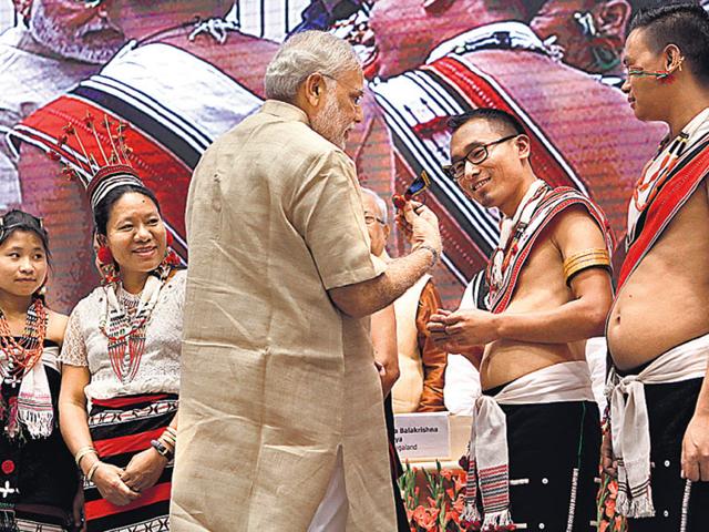 PM Narendra Modi interacts with performers during a function marking the birth centenary of freedom fighter Rani Gaidinliu. (Virendra Singh Gosain/ HT Photo)