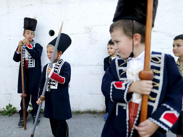 Alkar Vito (2nd left) prepares before the Children's Alka competition in Croatia. (Reuters)