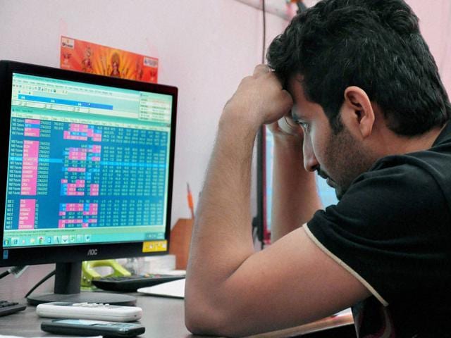 A broker reacts to the Monday bloodbath at the BSE Sensex. (PTI photo)