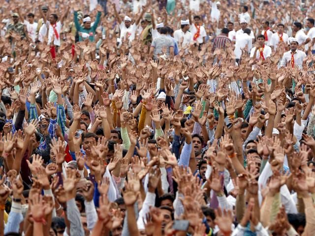 Members of the Patel community raise their arms as they shout slogans during a protest rally in Ahmedabad. (Reuters) Members of the Patel community raise their arms as they shout slogans during a protest rally in Ahmedabad. (Reuters)