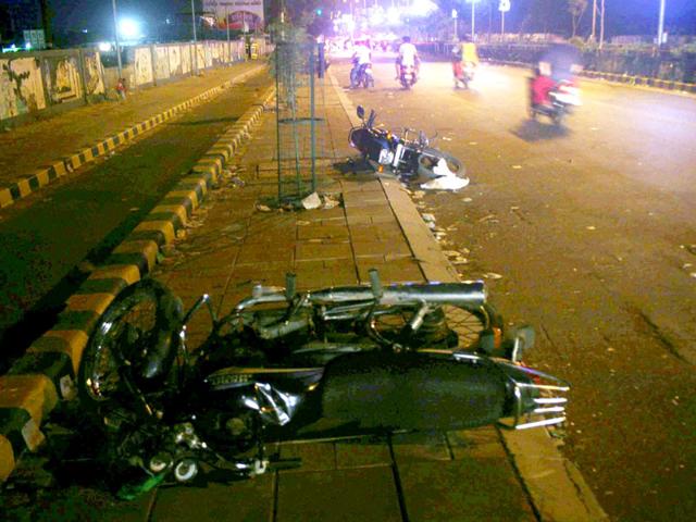 Motorbikes were damaged after thousands of protesters convened a demonstration in the state to pressurise the government into providing reservation to the Patidar community. (PTI Photo)