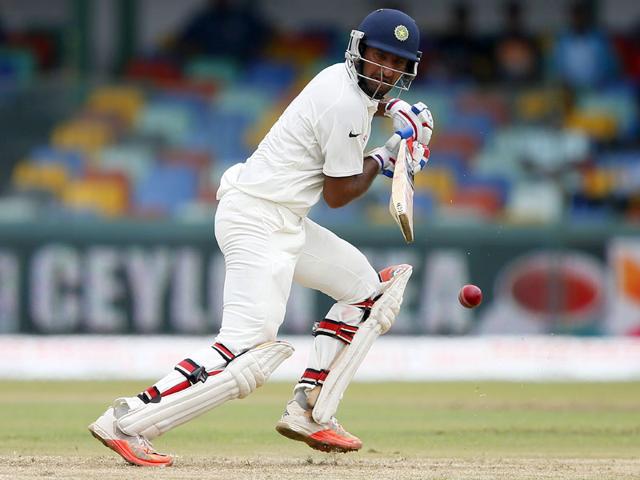 India's Cheteshwar Pujara plays a shot during the first session of play. (Reuters Photo) India's Cheteshwar Pujara plays a shot during the first session of play. (Reuters Photo)