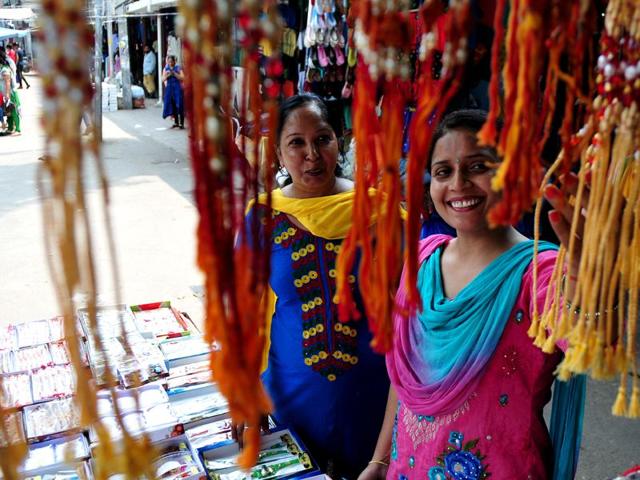 Women buying Rakhis for brothers at Sector 15 market. (Ravi Kumar/HT)