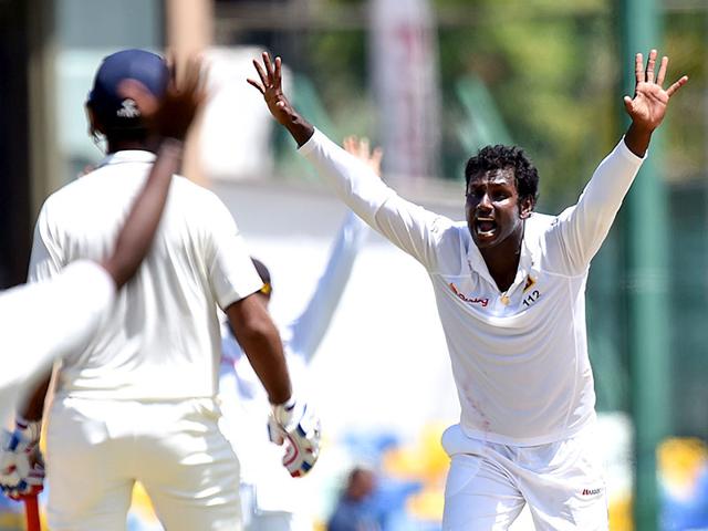 Mathews, right, successfully appeals for a Leg Before Wicket (LBW) decision against Rohit Sharma. (AFP Photo)