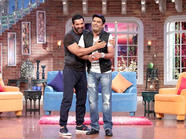 John Abraham hugs Kapil Sharma on the sets of Comedy Nights.