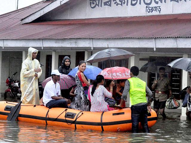 Rescue and relief operation in progress during the floods in Dibrugarh. (PTI Photo)
