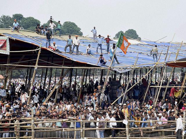 Supporters at the NDA's Parivartan Rally at the Airport Ground in Bhagalpur on Tuesday. (PTI Photo)